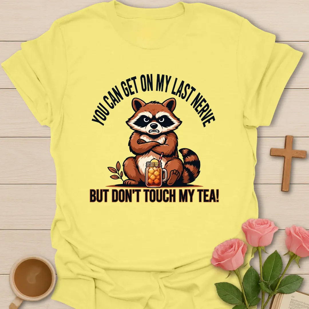 Grumpy Raccoon Sweet Tea t-shirt with a grumpy raccoon and sweet tea faith design - Cornsilk
