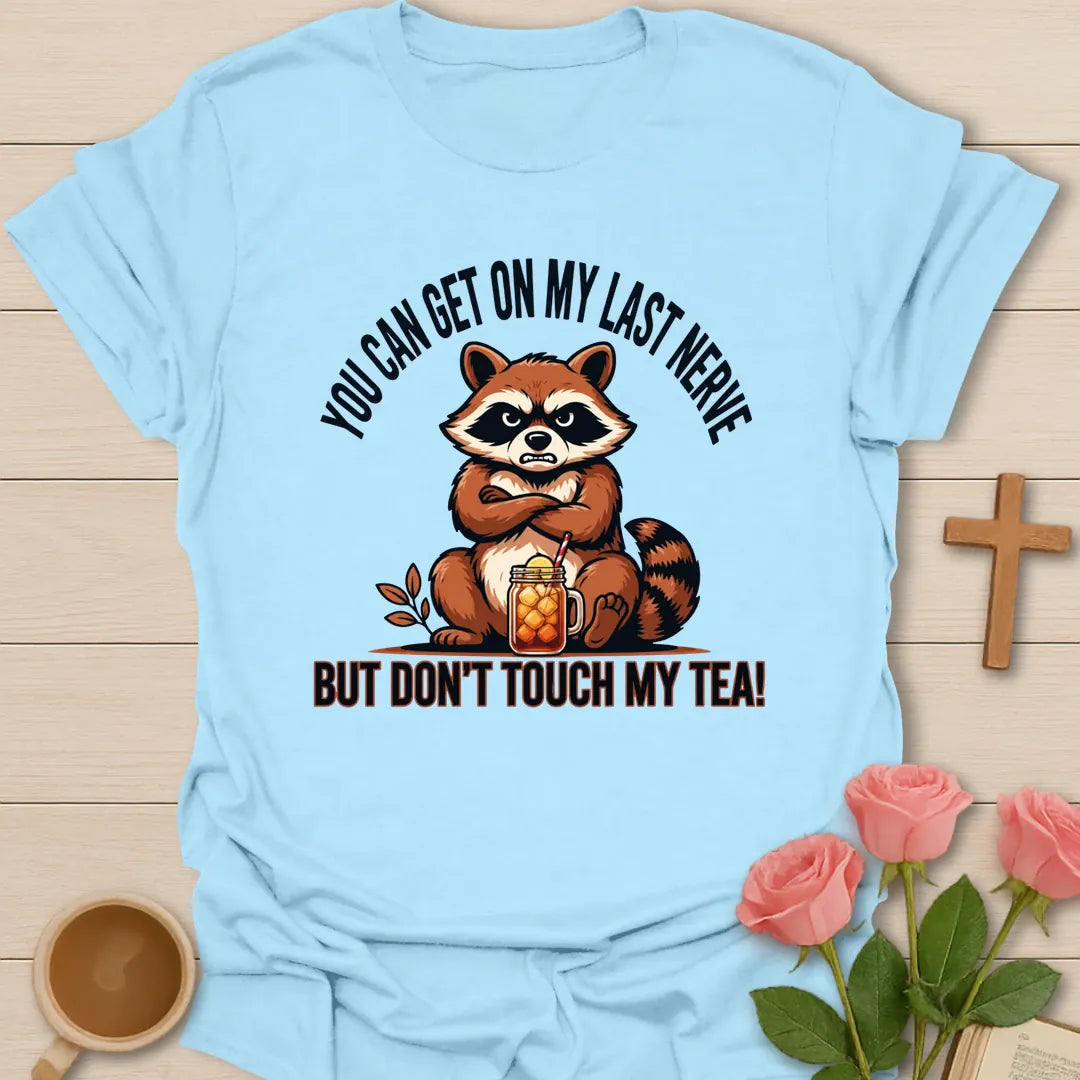 Grumpy Raccoon Sweet Tea t-shirt with a grumpy raccoon and sweet tea faith design - Light Blue