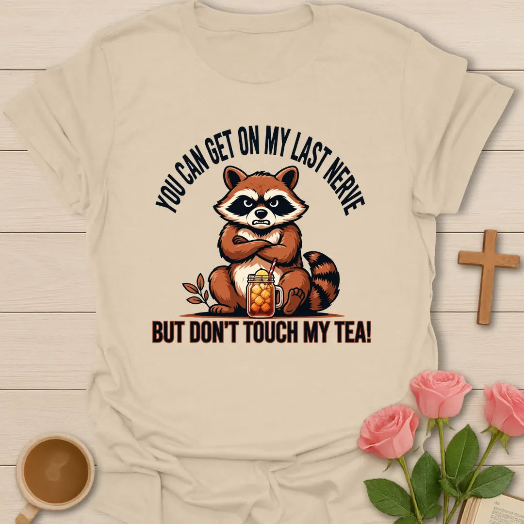 Grumpy Raccoon Sweet Tea t-shirt with a grumpy raccoon and sweet tea faith design - Sand