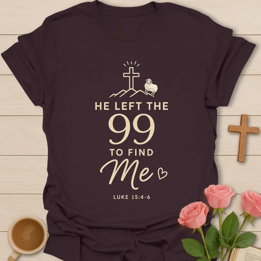 He Left The 99 To Find Me shirt with cross, mountain line art, small sheep, heart, and Luke 15:4-6 text. - Dark Chocolate