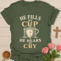 He Fills My Cup, He Hears My Cry t-shirt with vintage lettering and tea pouring into an overflowing cross-marked teacup. - Military Green