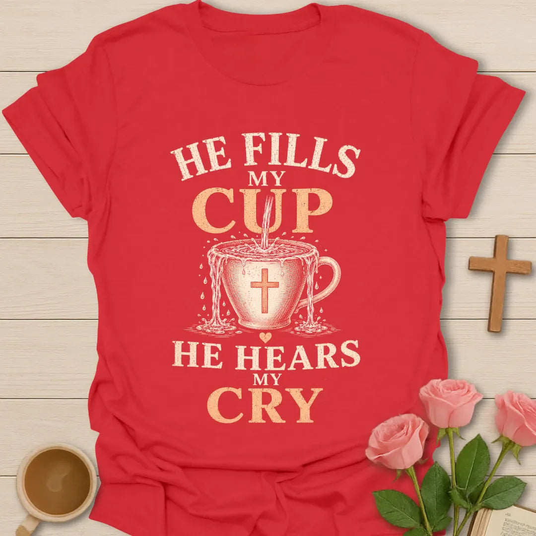 He Fills My Cup, He Hears My Cry t-shirt with vintage lettering and tea pouring into an overflowing cross-marked teacup. - Red