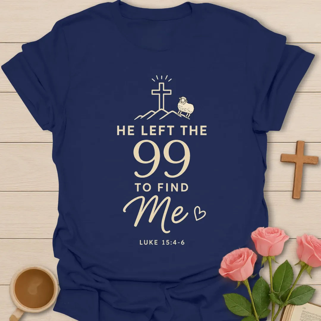 He Left The 99 To Find Me shirt with cross, mountain line art, small sheep, heart, and Luke 15:4-6 text. - Navy