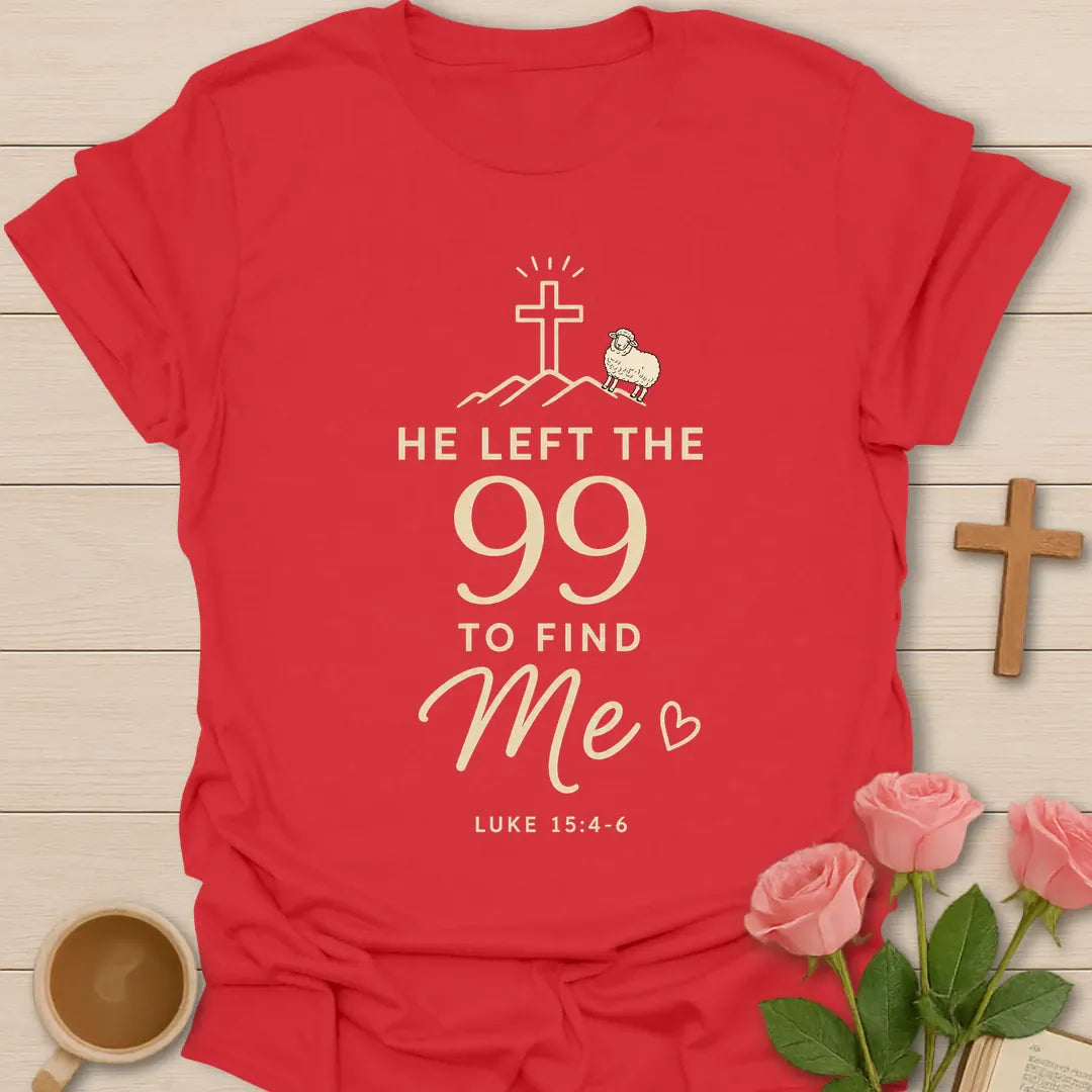 He Left The 99 To Find Me shirt with cross, mountain line art, small sheep, heart, and Luke 15:4-6 text. - Red