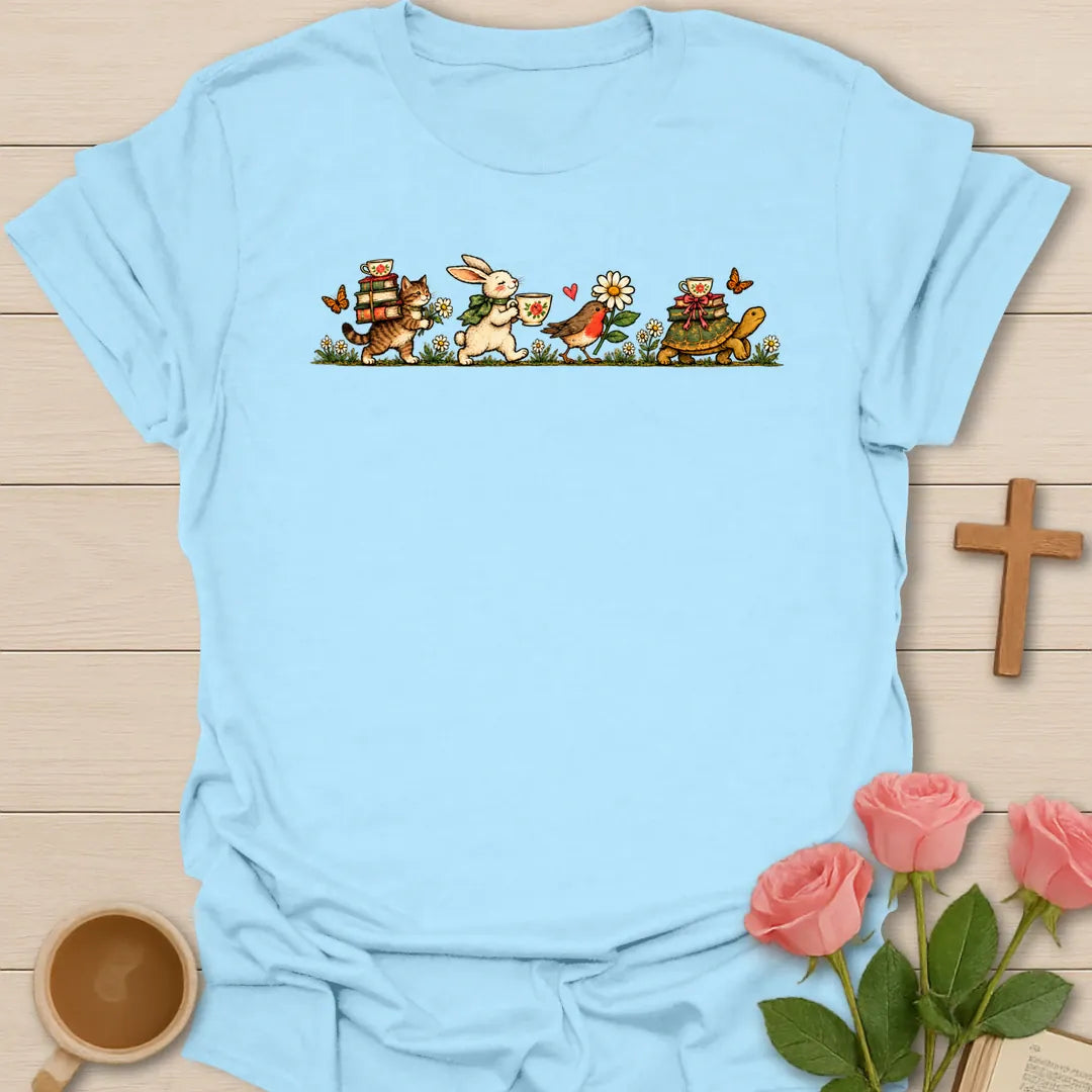 Heading To The Tea Party t-shirt with a vintage parade of a cat carrying books, a bunny with a teacup, a robin and a tortoise with a teacup - Light Blue