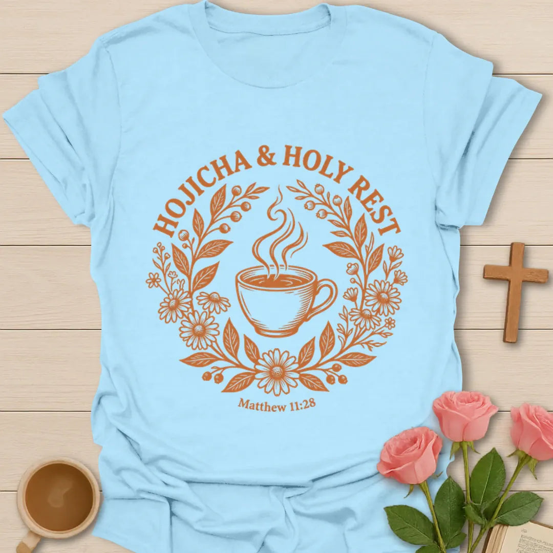 Hojicha and Holy Rest shirt with steaming teacup, floral wreath, botanical details, and Matthew 11:28 text. - Light Blue