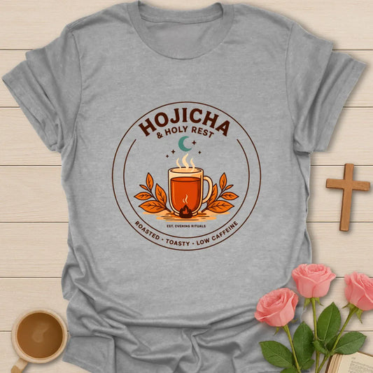 Hojicha and Holy Rest shirt with steaming amber tea, moon, leaves, evening ritual badge, and low caffeine text. - Sport Grey
