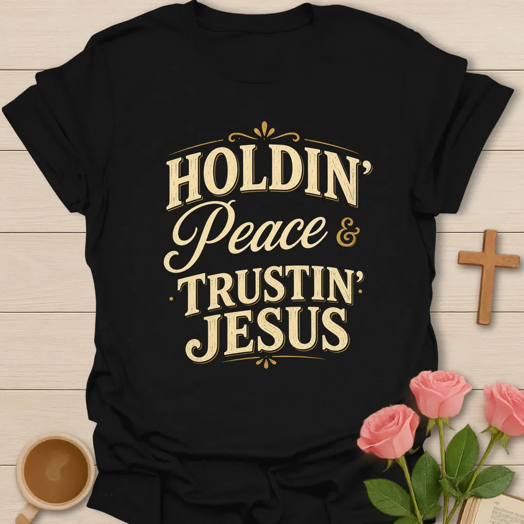 Holdin Peace and Trustin Jesus shirt with cream vintage lettering, script peace text, and bold stacked typography. - Black