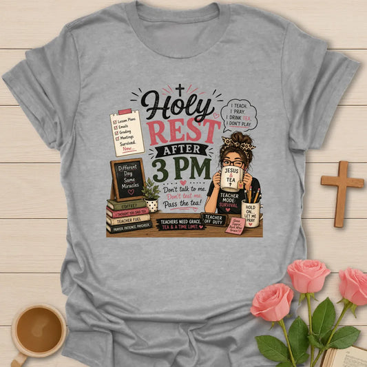 Holy Rest After 3 PM teacher shirt with teacher drinking from Jesus and Tea mug, lesson notes, books, chalkboard, pencils, and pink accents. - Sport Grey