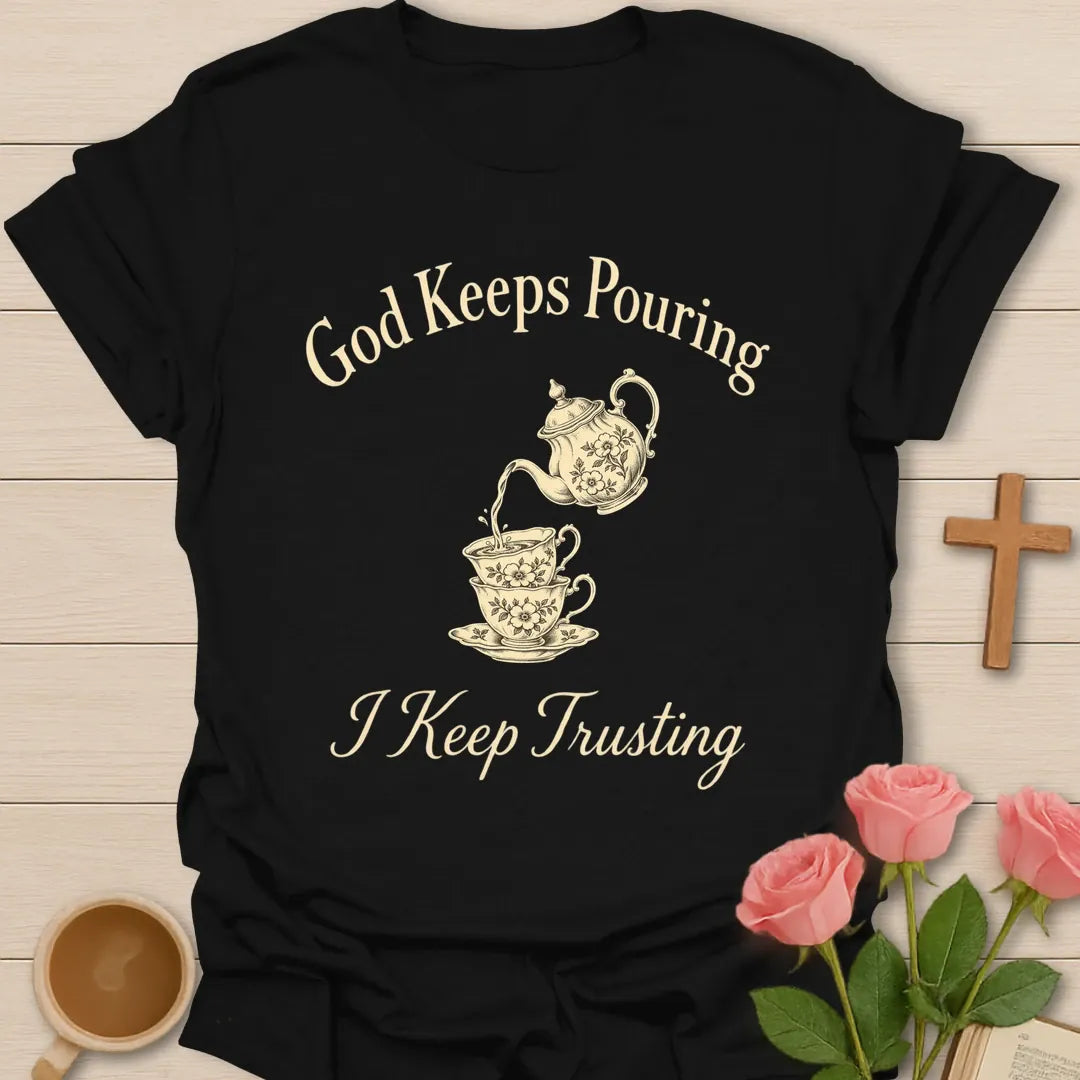 God Keeps Pouring I Keep Trusting Christian t-shirt with vintage teapot pouring into stacked teacups - Black
