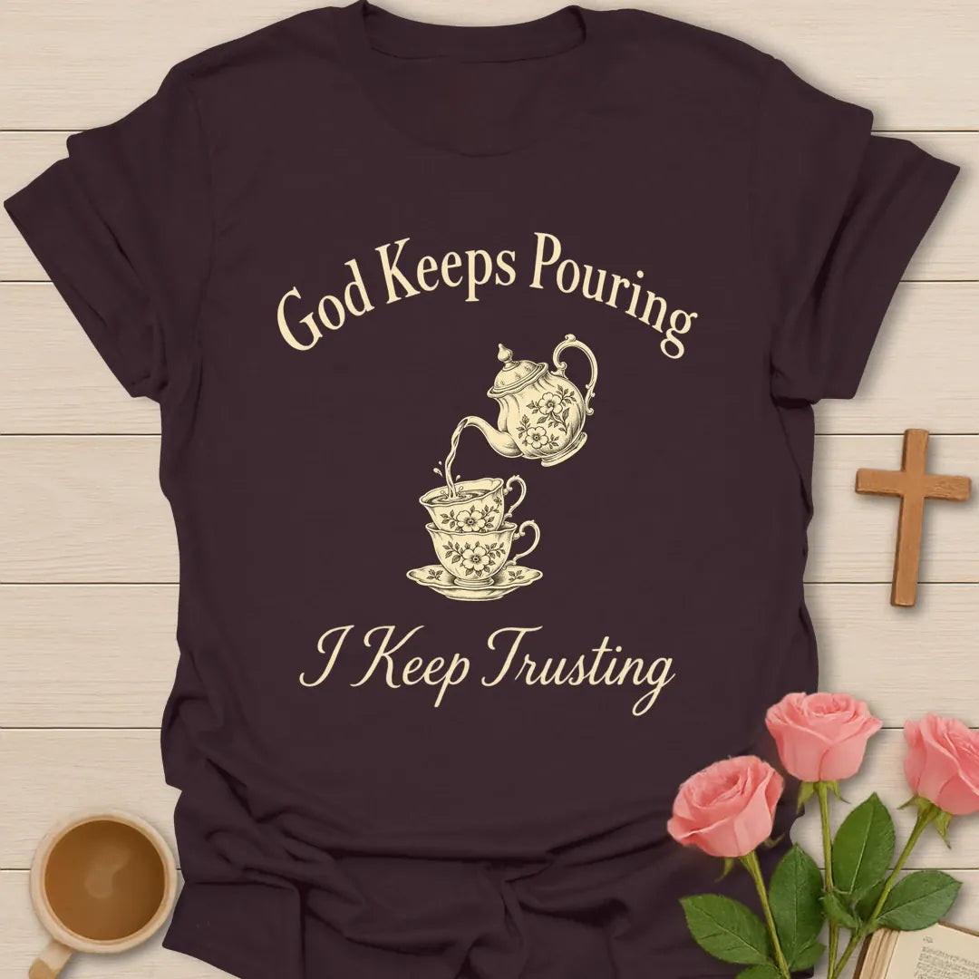 God Keeps Pouring I Keep Trusting Christian t-shirt with vintage teapot pouring into stacked teacups - Dark Chocolate