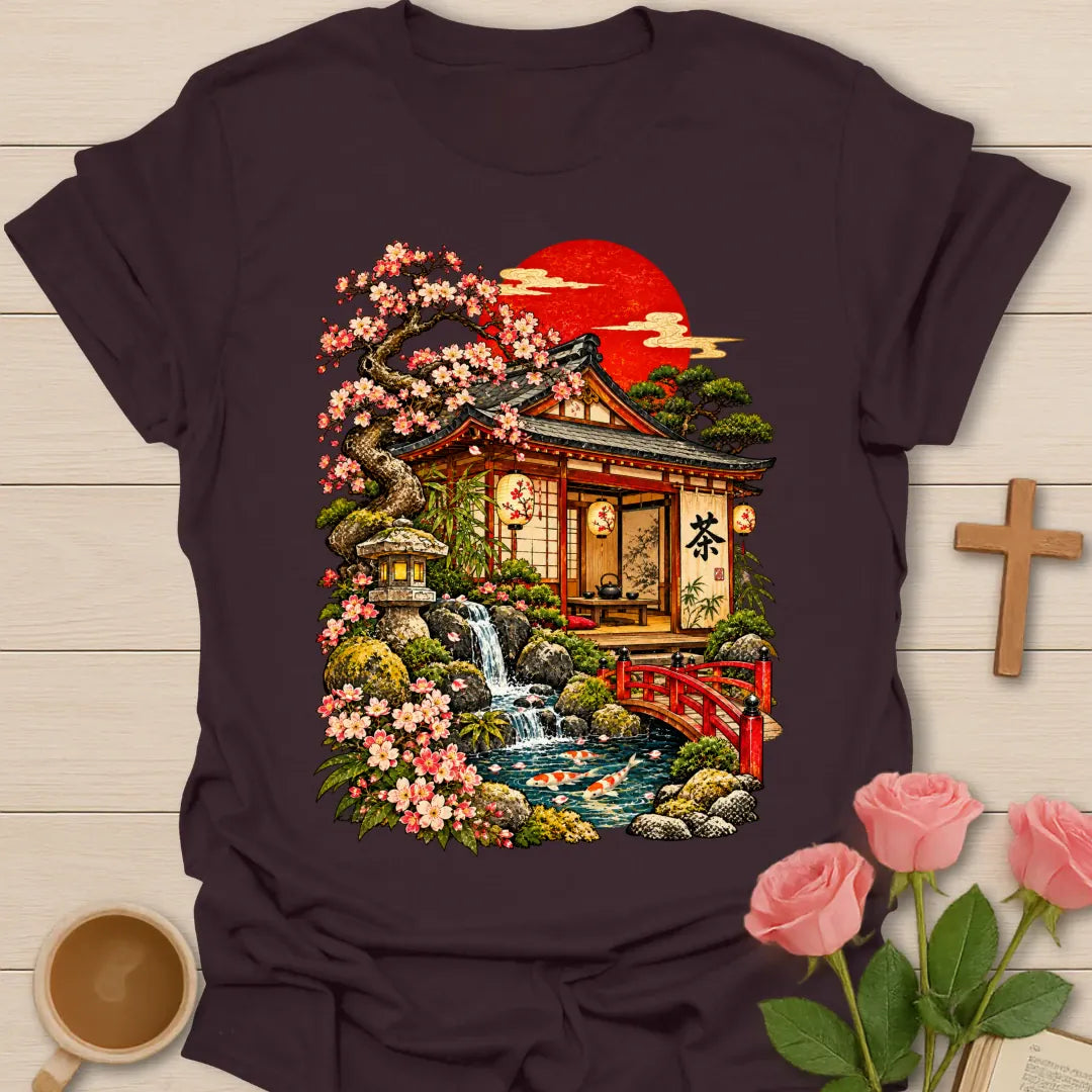 Japanese Tea House t-shirt with a traditional tea house, pink cherry blossoms, a stone lantern, waterfall, koi pond, red bridge and a red rising sun - Dark Chocolate