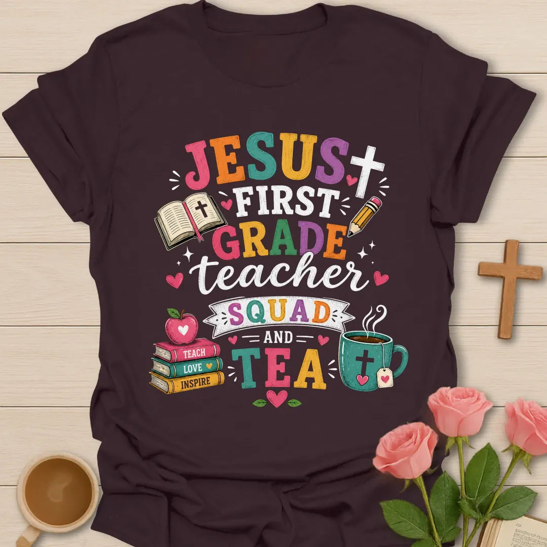 Jesus First Grade Teacher Squad and Tea shirt with colorful distressed letters, Bible, pencil, apple, book stack, tea mug, hearts, and banner. - Dark Chocolate