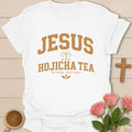 Jesus and Hojicha Tea shirt with varsity lettering, cross, leaves, and Sip Slow Trust Deep phrase. - White