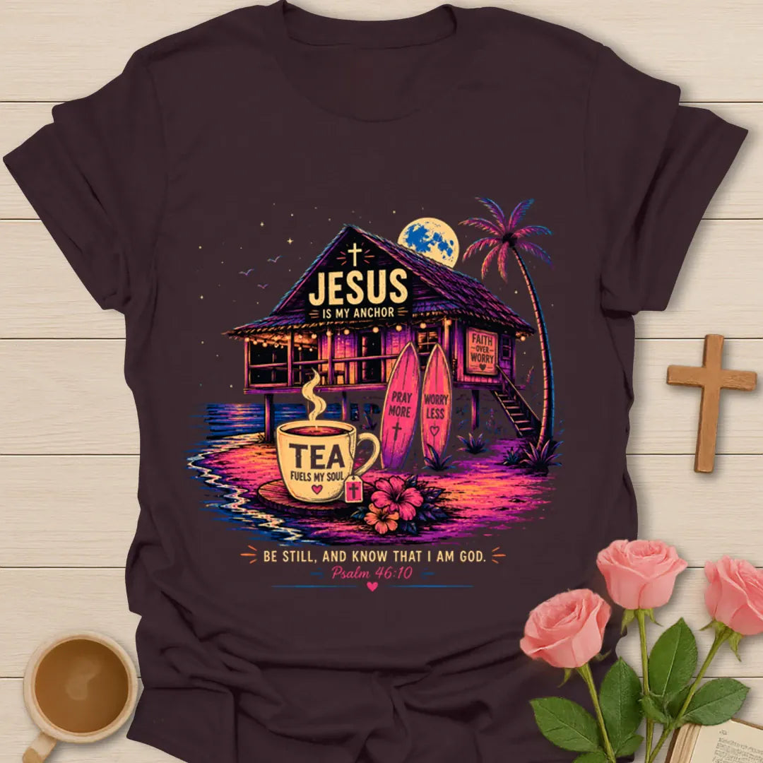 Jesus Is My Anchor tea shirt with beach hut, surfboards, palm tree, moon, teacup, and Psalm 46:10 text. - Dark Chocolate