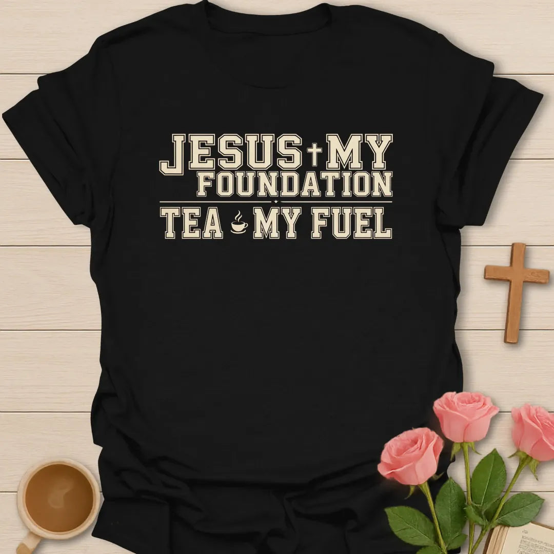 Jesus My Foundation Tea My Fuel shirt with varsity cream lettering, small teacup icon, cross, and distressed vintage style. - Black