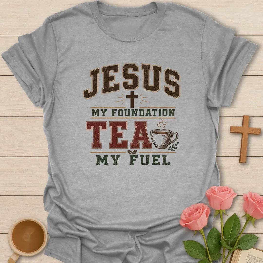 Jesus My Foundation Tea My Fuel shirt with distressed varsity letters, cross, steaming teacup, and earth tone colors. - Sport Grey