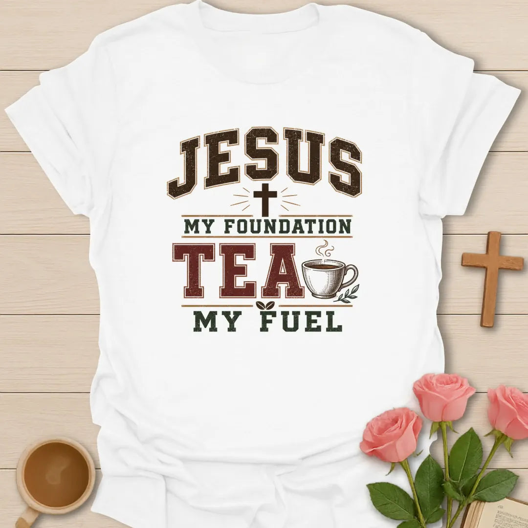Jesus My Foundation Tea My Fuel shirt with distressed varsity letters, cross, steaming teacup, and earth tone colors. - White