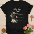 Jesus Says I Am tea shirt with teacup, flowers, cross, and trustworthy everlasting love always with you affirmations. - Black