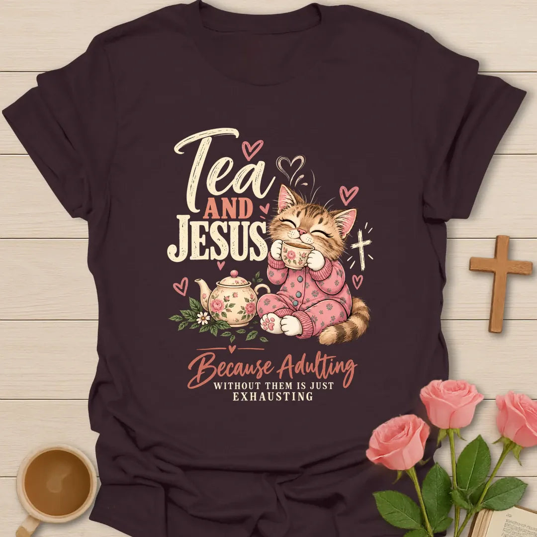 Tea and Jesus Because Adulting Without Them Is Just Exhausting t-shirt with a cat in pink pajamas sipping tea beside a floral teapot and cross - Dark Chocolate