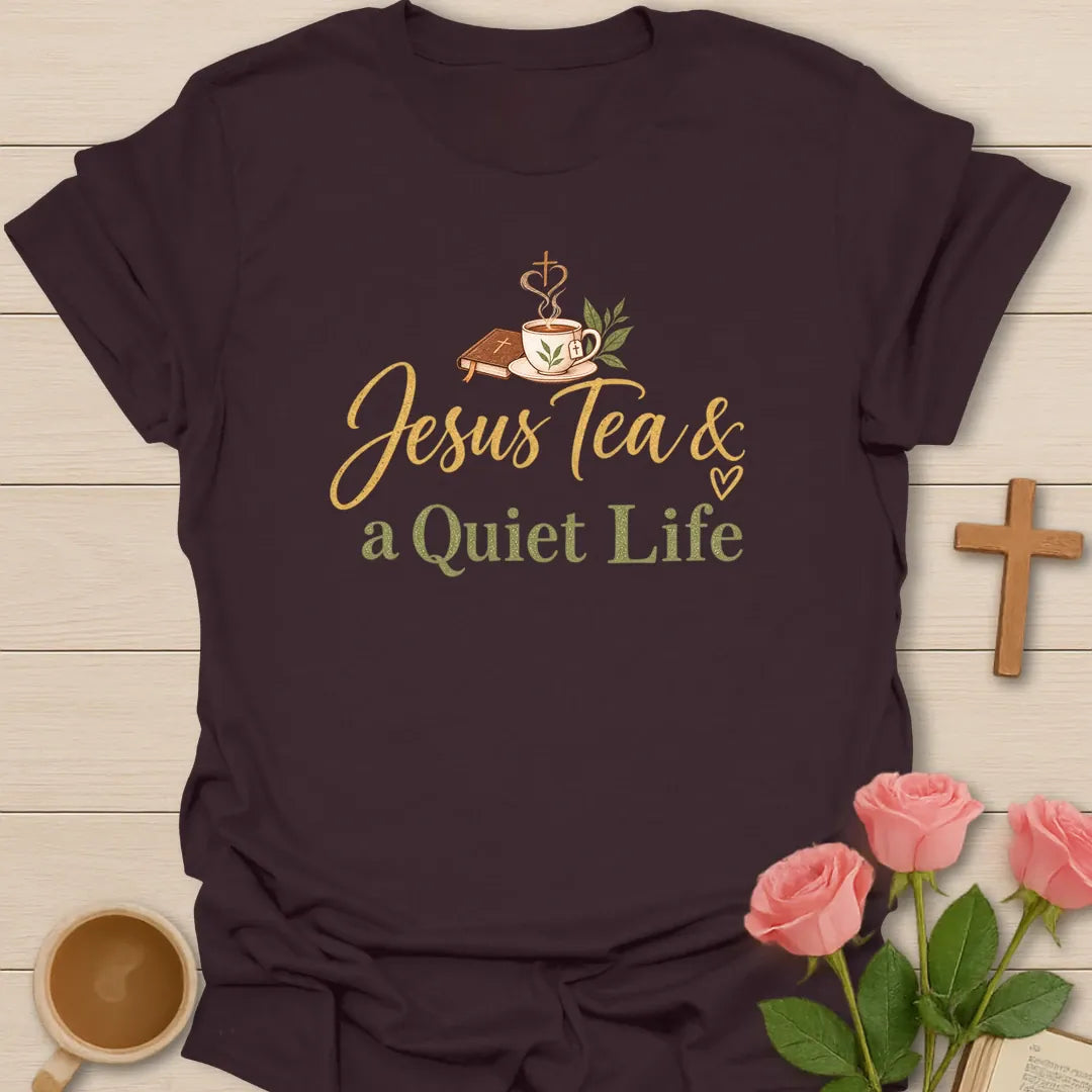 Jesus Tea and a Quiet Life t-shirt with gold and sage script, a closed Bible and a teacup with cross-shaped steam. - Dark Chocolate