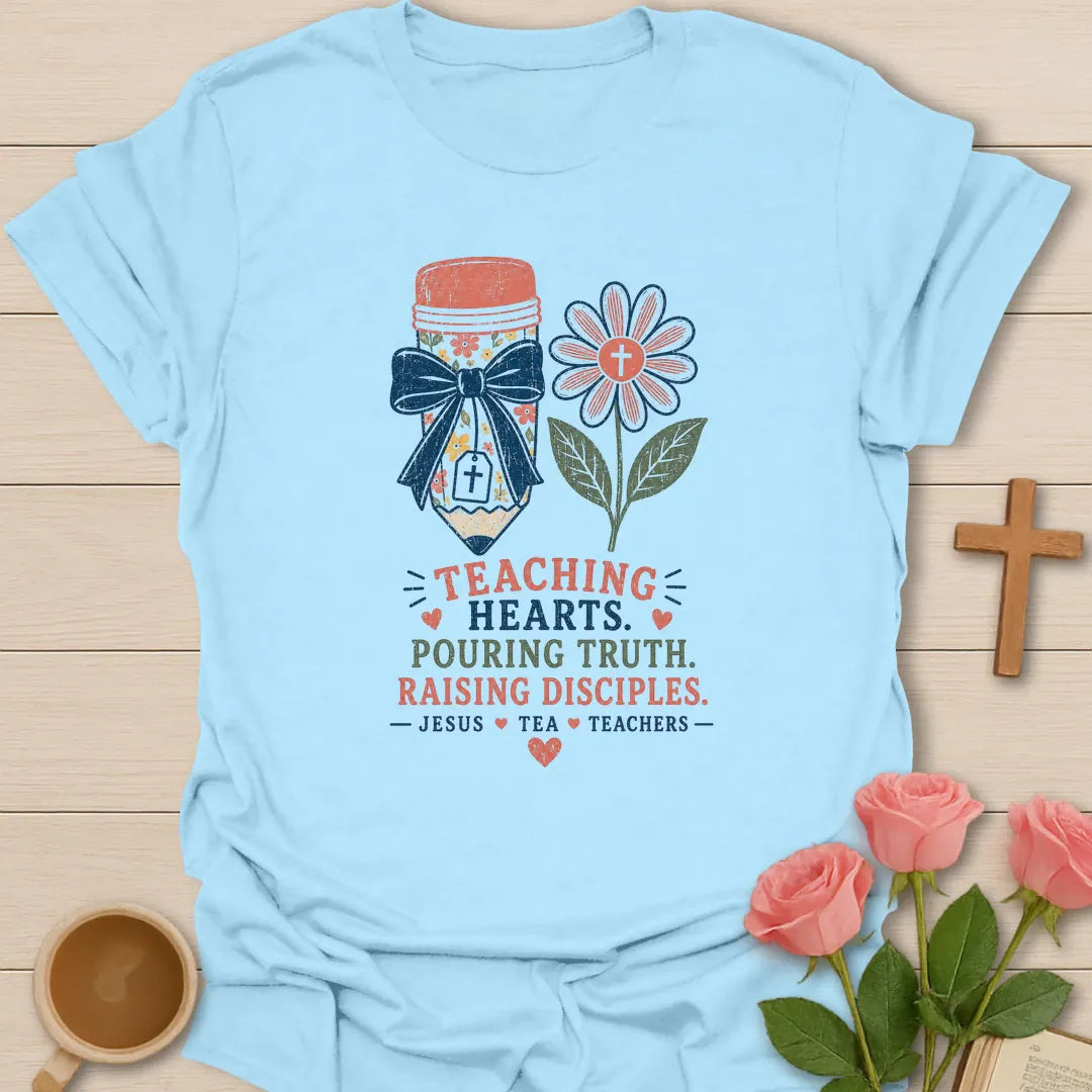 Jesus Tea and Teachers shirt with teacup, books labeled Teach Love Inspire, pencil cup, flower, hearts, and vintage boutique colors. - Light Blue