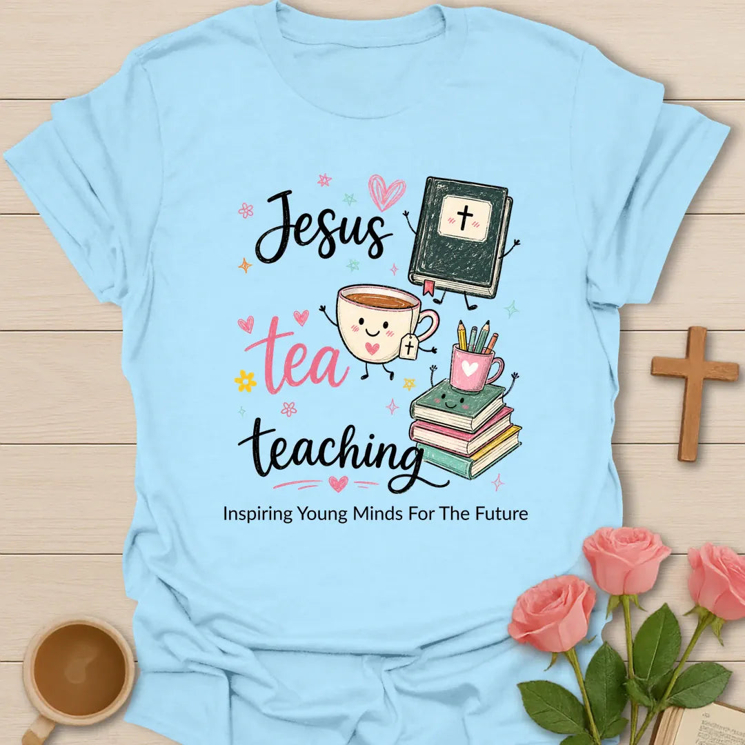 Jesus Tea Teaching shirt with black script text, pink tea lettering, smiling tea cup, Bible, books, pencil cup, stars, hearts, and floral doodles. - Light Blue