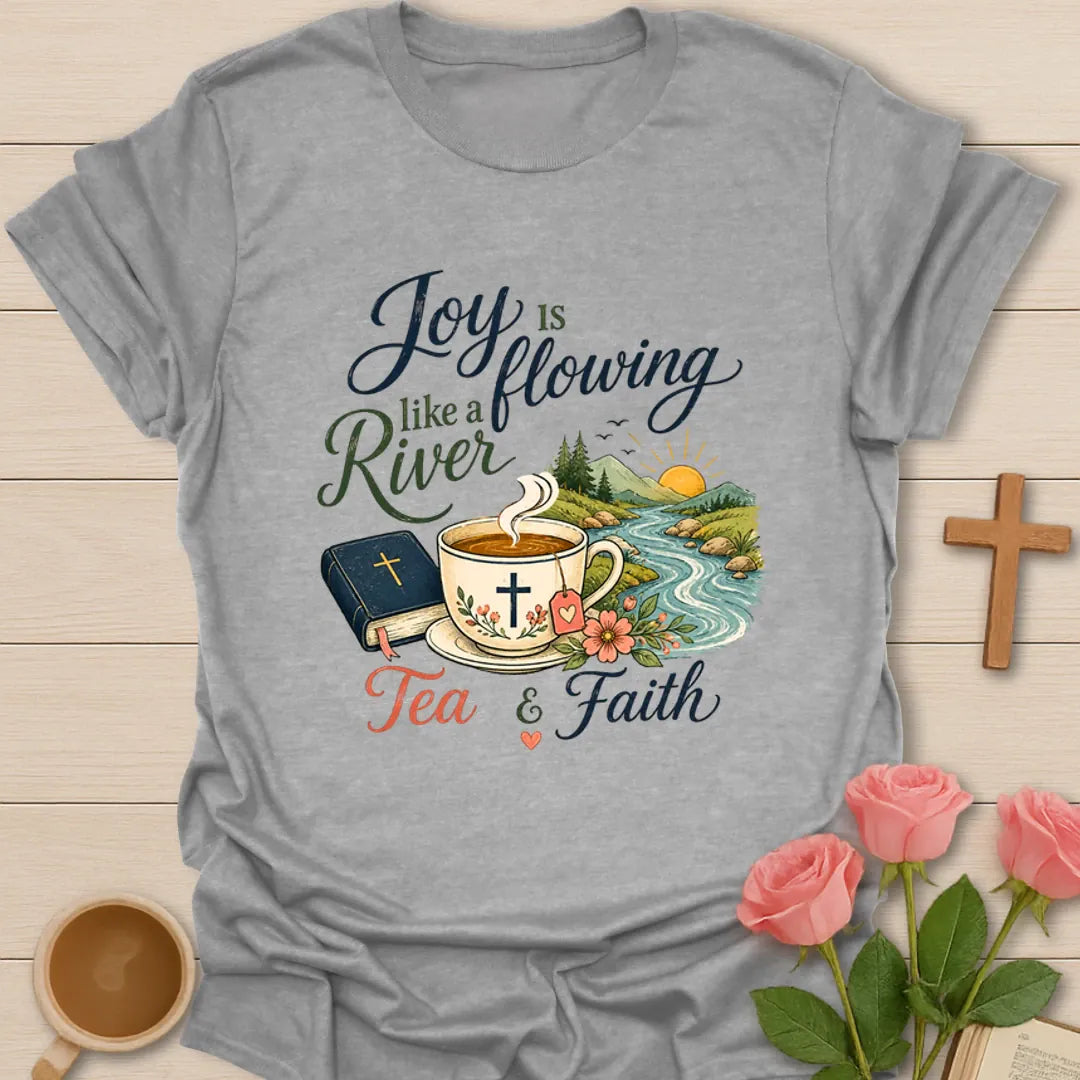 Joy Is Flowing Like A River shirt with teacup, Bible, river, mountains, sunrise, flowers, and tea faith text. - Sport Grey