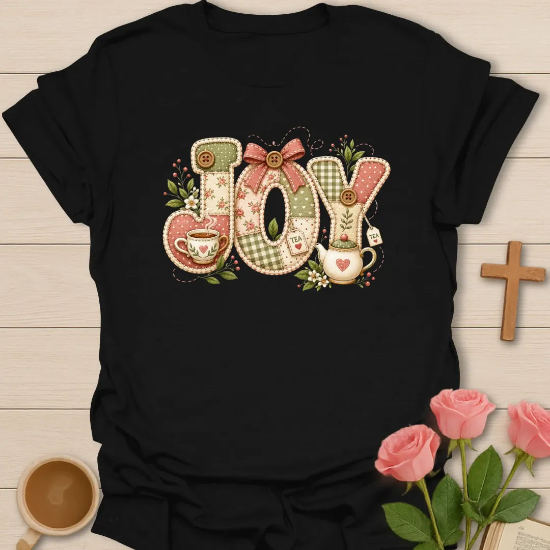 Joy Tea faux patchwork shirt with stitched fabric letters, pink bow, teacup, teapot, tea tags, florals, and soft cottagecore colors. - Black