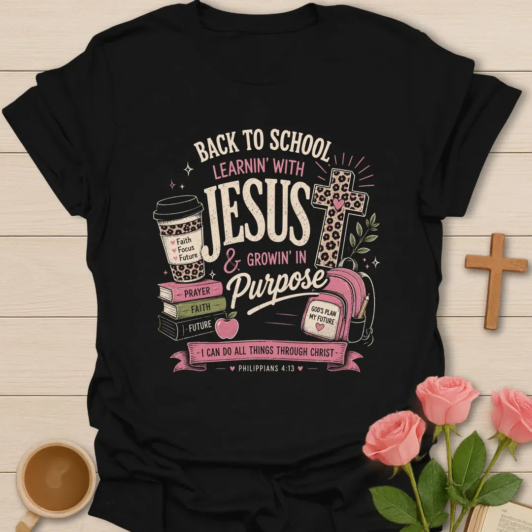 Learning With Jesus back to school shirt with books, backpack, cross, coffee cup, apple, and Philippians 4:13 text. - Black