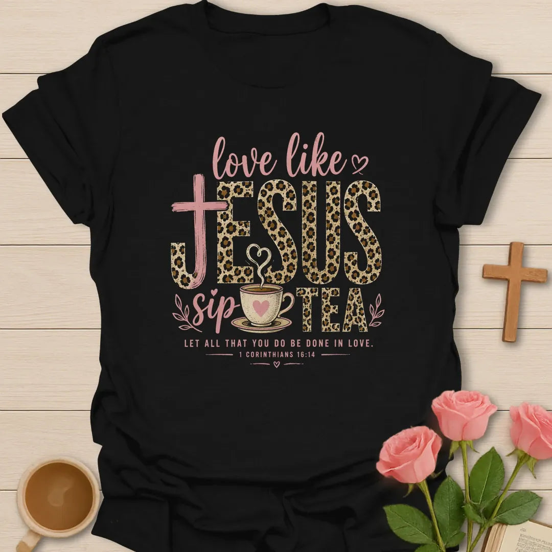 Love Like Jesus Sip Tea shirt with leopard JESUS lettering, teacup, cross, heart, and 1 Corinthians 16:14 text. - Black