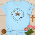 Love Tea Gratitude and Grace shirt with teacup, wreath, holly, berries, snowflakes, and warm vintage accents. - Light Blue