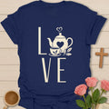 Love Tea shirt with teapot, teacup, heart, leaves, and large cream LOVE lettering. - Navy