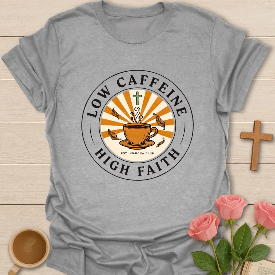 Low Caffeine High Faith shirt with Hojicha tea cup, sunburst, cross, falling leaves, and circular badge design. - Sport Grey