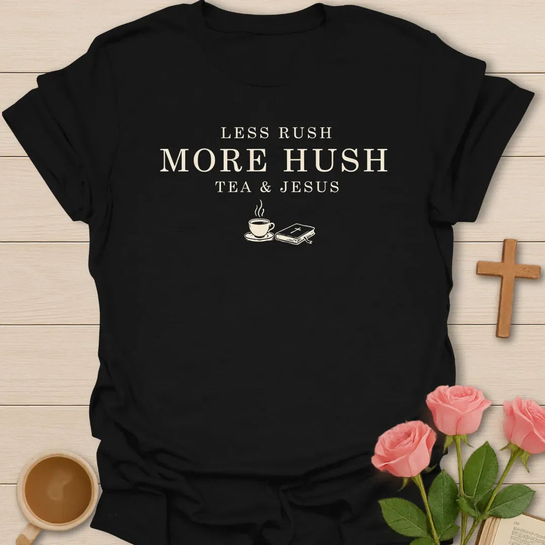 Less Hustle More Hush shirt with cross and cream vintage lettering. - Black