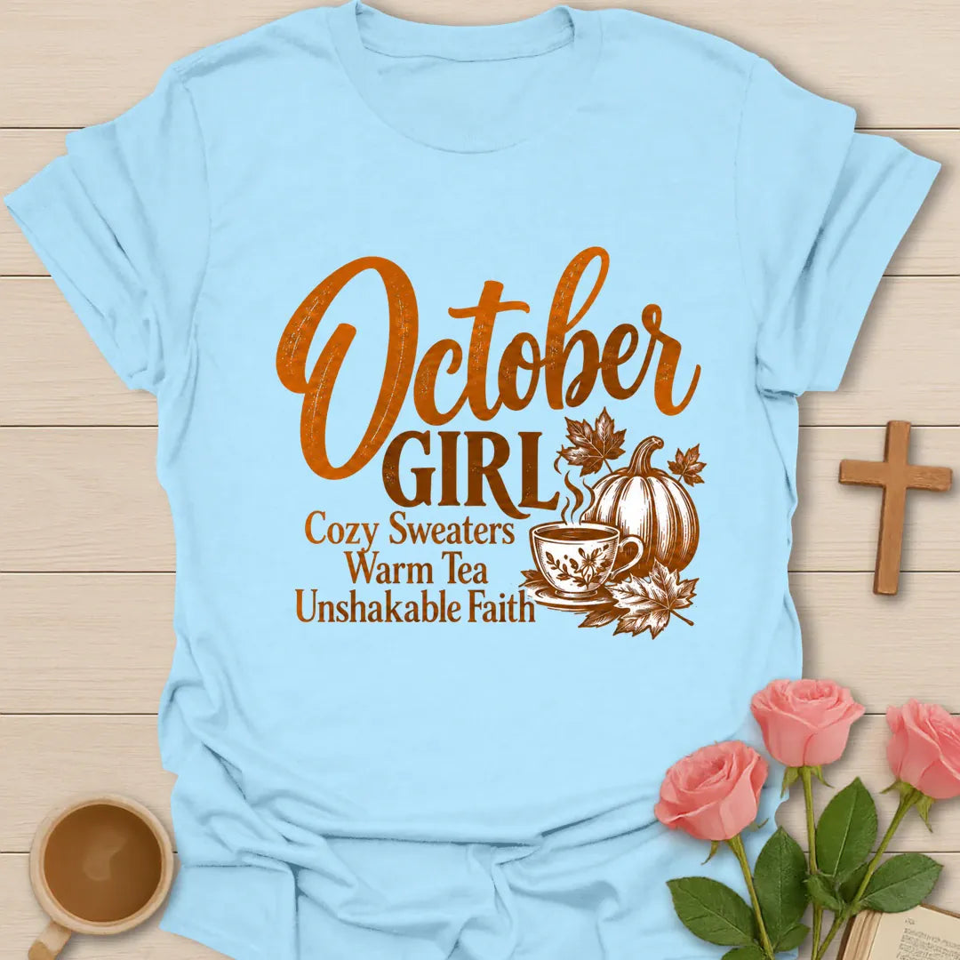 October Girl Cozy Sweaters Warm Tea Unshakable Faith t-shirt in engraved autumn style with a pumpkin, maple leaves and a steaming teacup - Light Blue