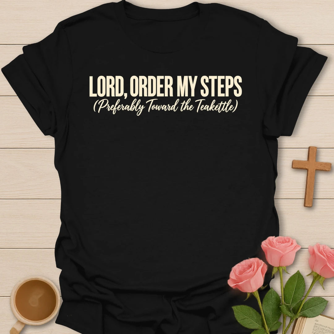 Lord, Order My Steps (Preferably Toward the Teakettle) t-shirt with bold cream lettering and a script subtitle - Black