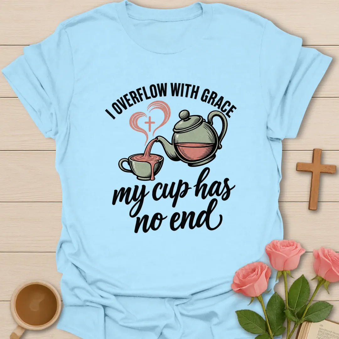 Overflowing Cup shirt with warm lettering and a faith-inspired teacup design. - Light Blue