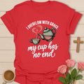 Overflowing Cup shirt with warm lettering and a faith-inspired teacup design. - Red
