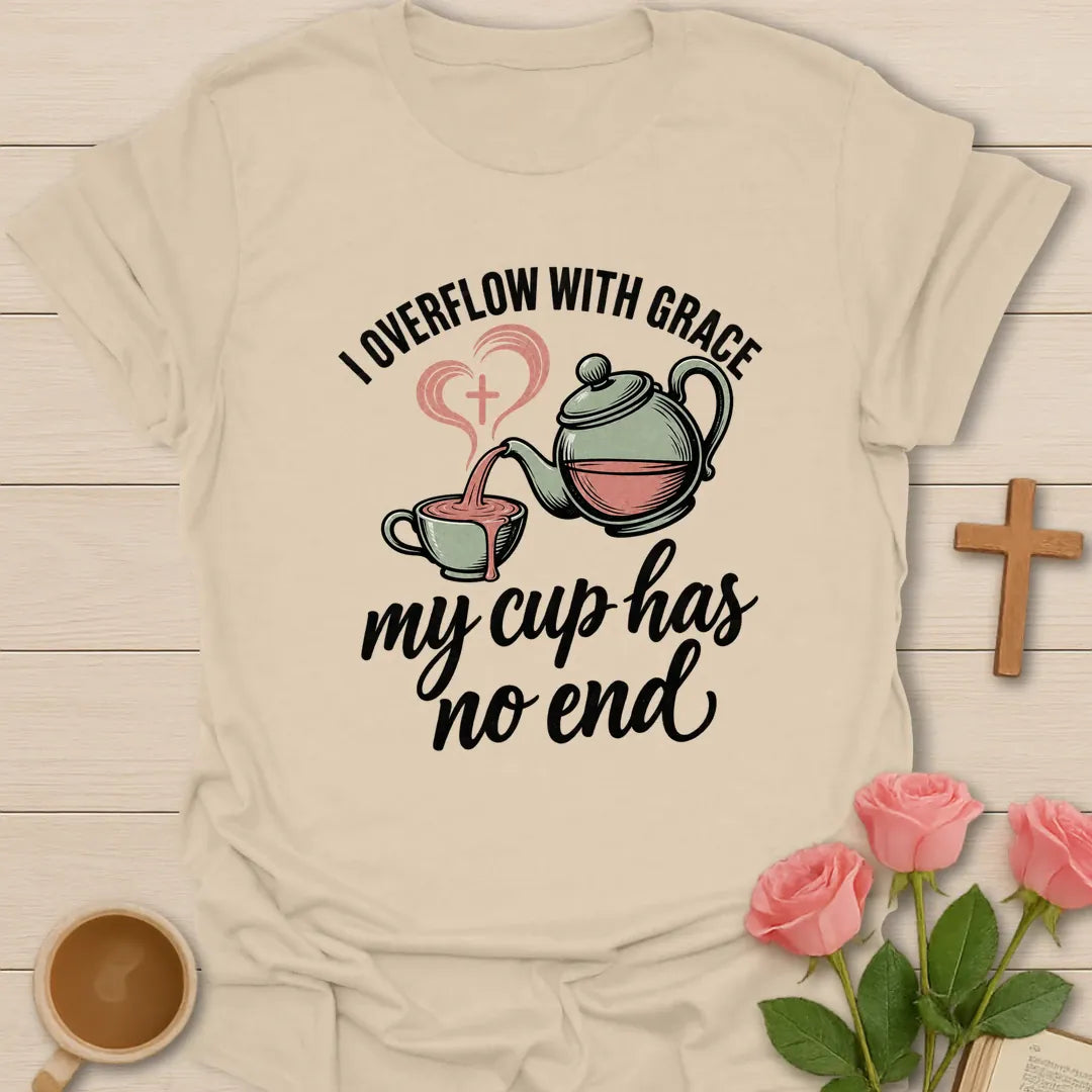 Overflowing Cup shirt with warm lettering and a faith-inspired teacup design. - Sand