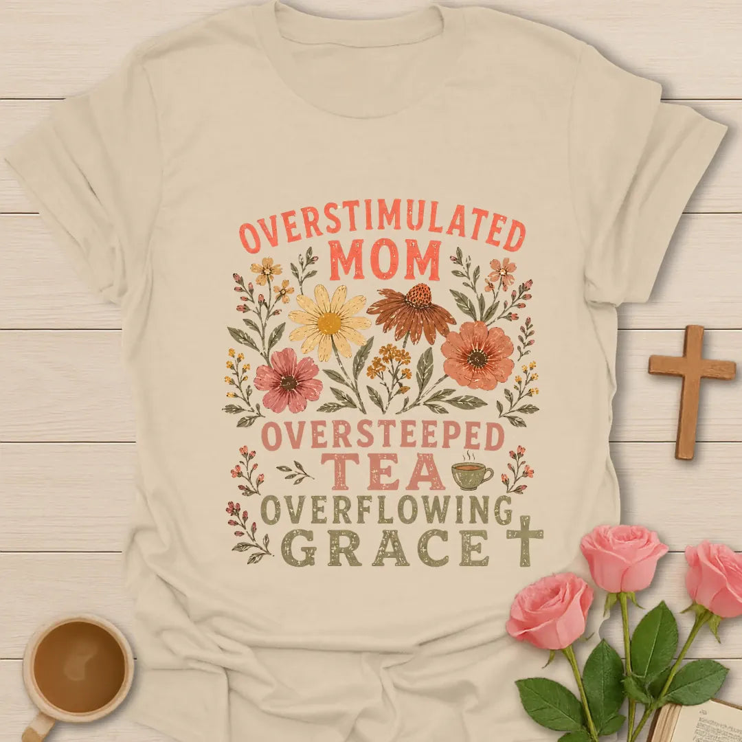 Overstimulated Oversteeped Overflowing Mom shirt with teacup, playful lettering, and faith design. - Sand