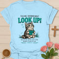 Overwhelmed Look Up Kitty Christian t-shirt with a cat and Jesus tea mug design and 1 Peter 5:7 encouragement text - Light Blue