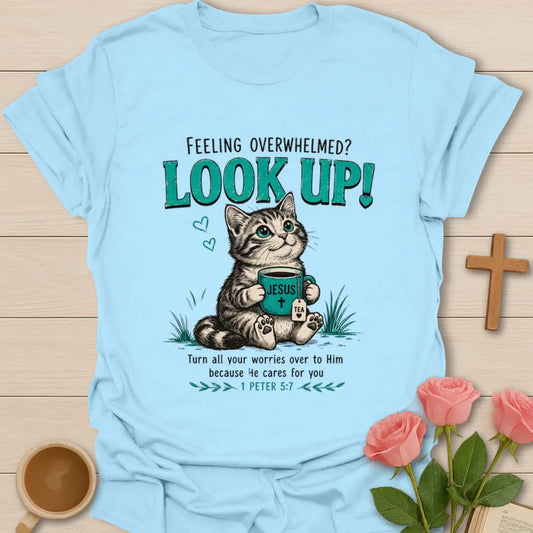 Overwhelmed Look Up Kitty Christian t-shirt with a cat and Jesus tea mug design and 1 Peter 5:7 encouragement text - Light Blue
