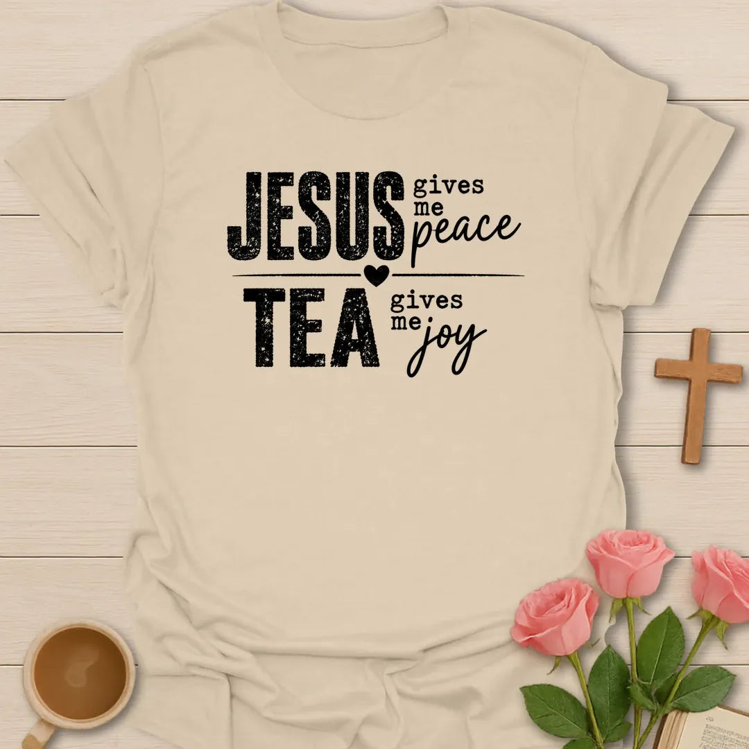 Jesus Gives Me Peace Tea Gives Me Joy shirt with distressed white lettering, heart divider, and bold stacked typography. - Sand