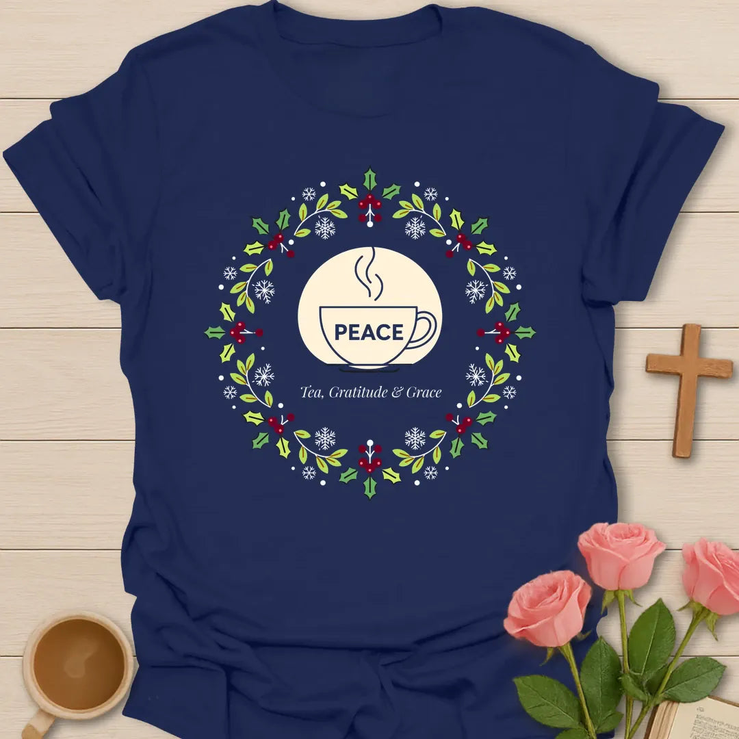 Peace Tea Gratitude and Grace shirt with teacup, wreath, holly berries, snowflakes, and peaceful Christmas design. - Navy