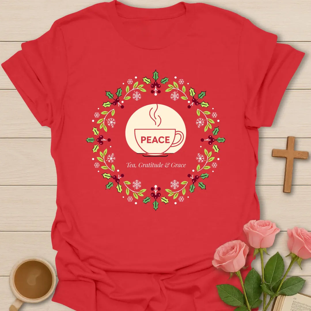 Peace Tea Gratitude and Grace shirt with teacup, wreath, holly berries, snowflakes, and peaceful Christmas design. - Red