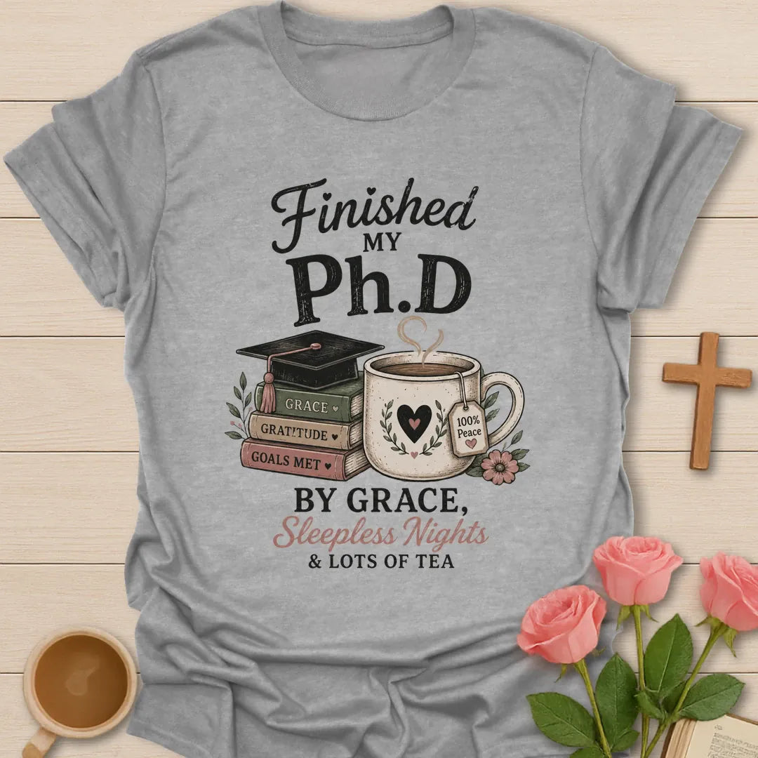 Ph.D Finished graduation shirt with graduation cap, faith message, and 2 Timothy 4:7 text. - Sport Grey
