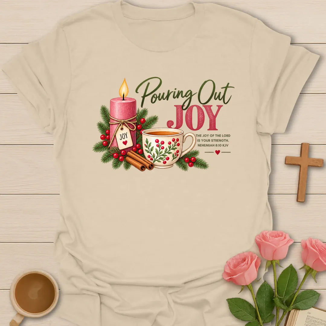 Pouring Out Joy Advent Christian tea t-shirt with festive lettering and faith-inspired design. - Sand