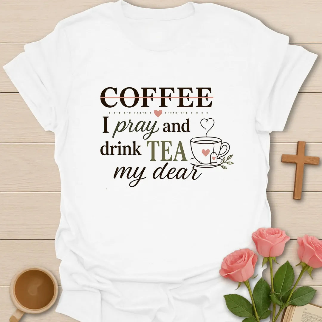 Pray and Drink Tea shirt with teacup, praying hands, and cream vintage lettering. - White