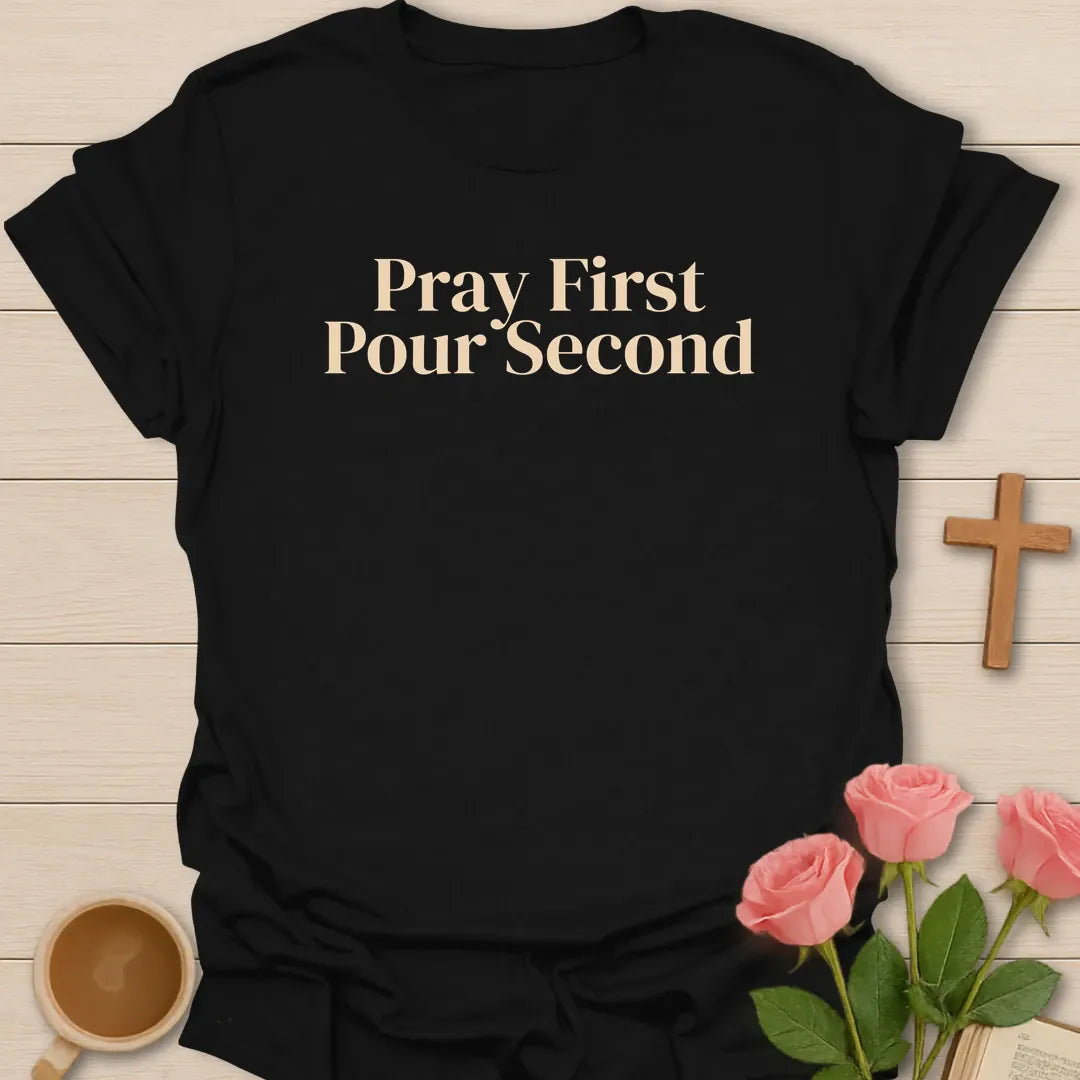 Pray First Pour Second Faith shirt with steaming teacup, cross, and cream vintage lettering. - Black